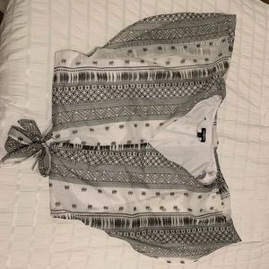 Light weight crop with a tie. Worn once.